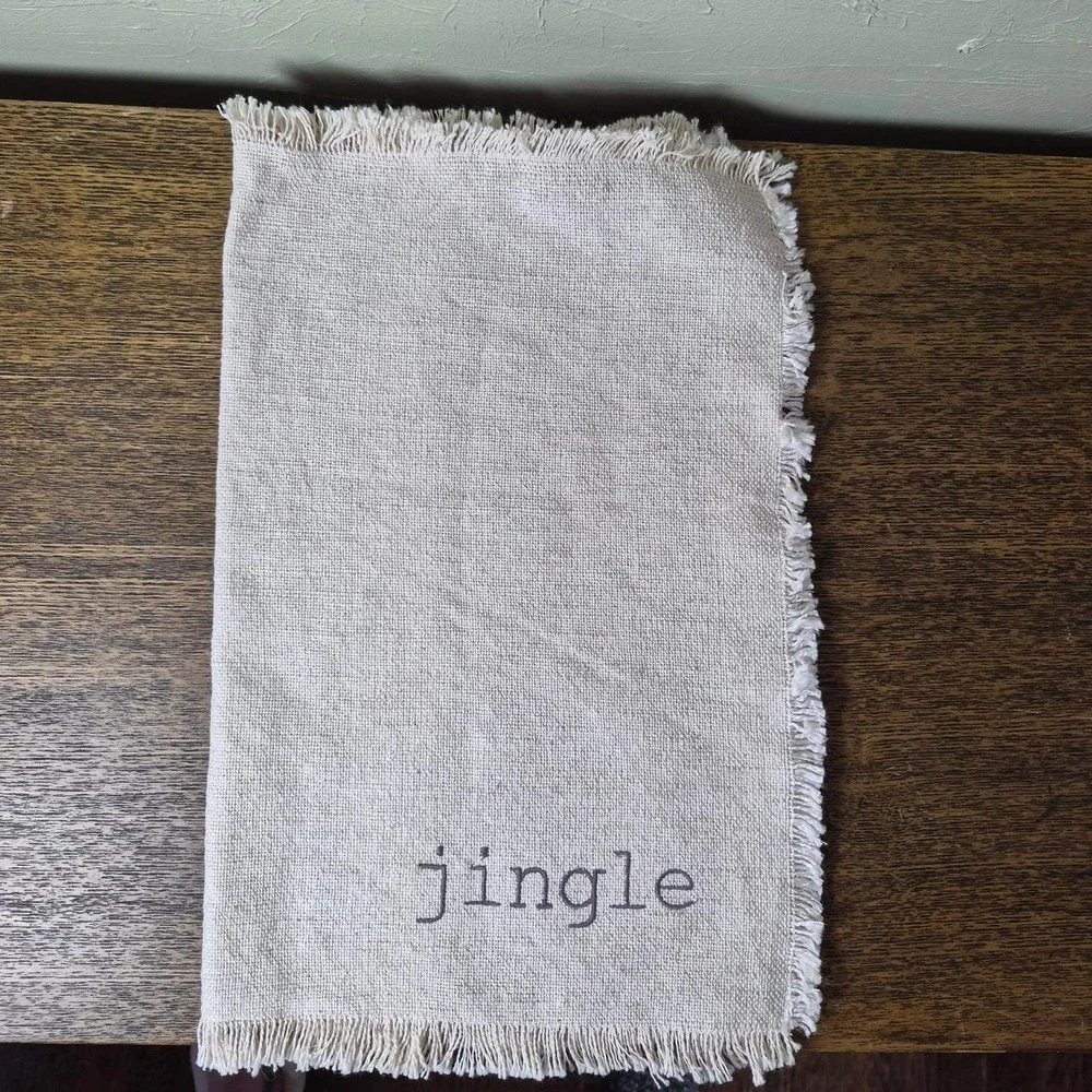 Cream Holiday Placemats (three total) - with the words 'jingle, jolly, & cheer'